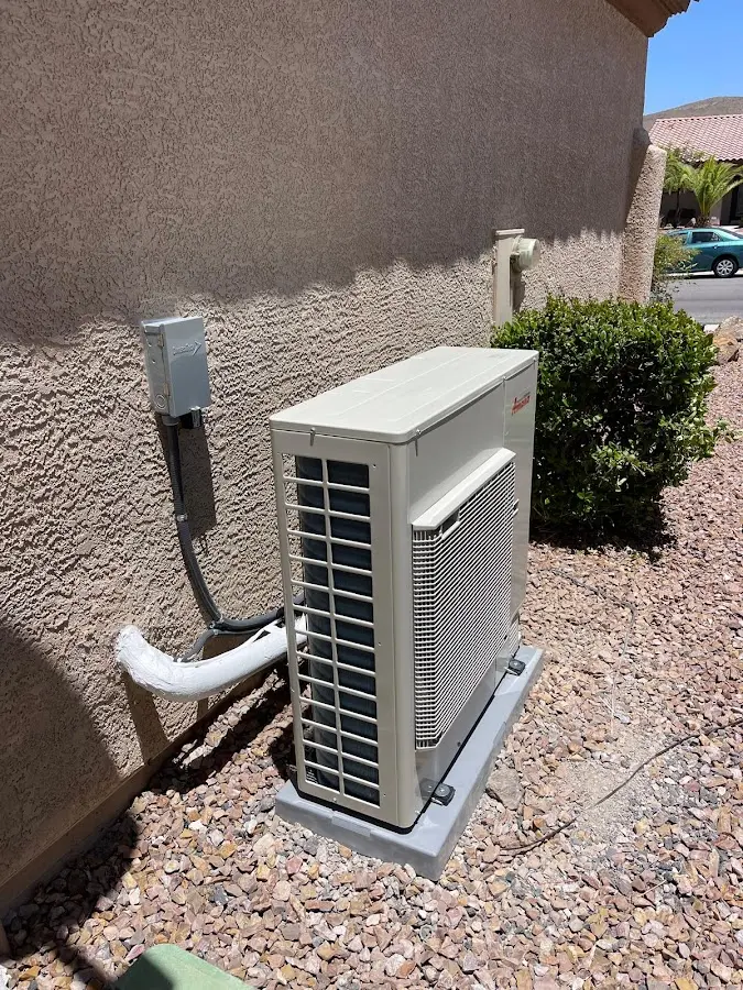 Residential air conditioning condenser unit in Orosi